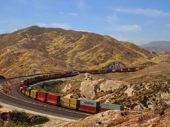 High angle view of train on tracks amidst landscape