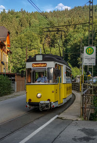 Yellow car on street in city