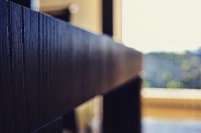 Close-up of railing against blurred background