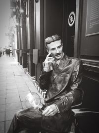 Man sitting in corridor