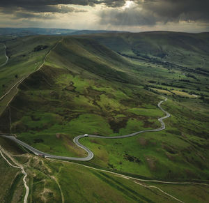 Aerial view of green landscape against sky