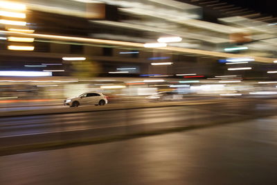 Blurred motion of cars on road in city at night