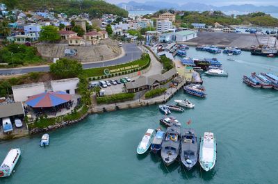 High angle view of boats moored at harbor