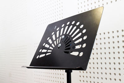 Low angle view of lighting equipment on wall