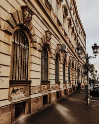 Street amidst buildings against sky