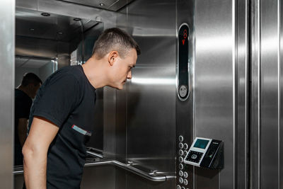 Side view of man working at airport