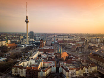 High angle view of city buildings during sunset