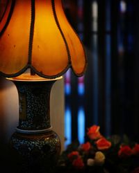 Close-up of illuminated lantern at home