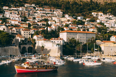 High angle view of townscape by sea