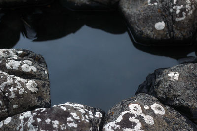 High angle view of rock formation in sea