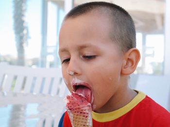 Close-up of boy eating ice cream