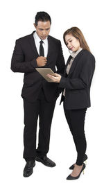 Portrait of a young couple standing against white background