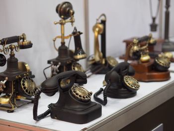 High angle view of vintage telephones on table