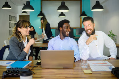 Happy business colleagues in office