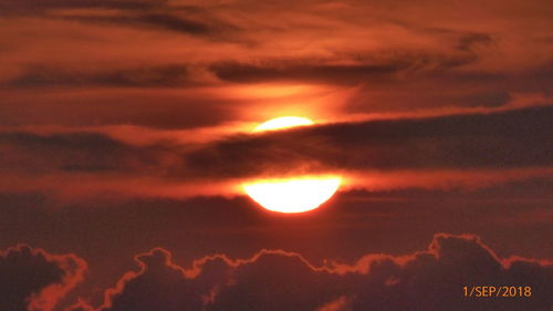 Low angle view of dramatic sky during sunset