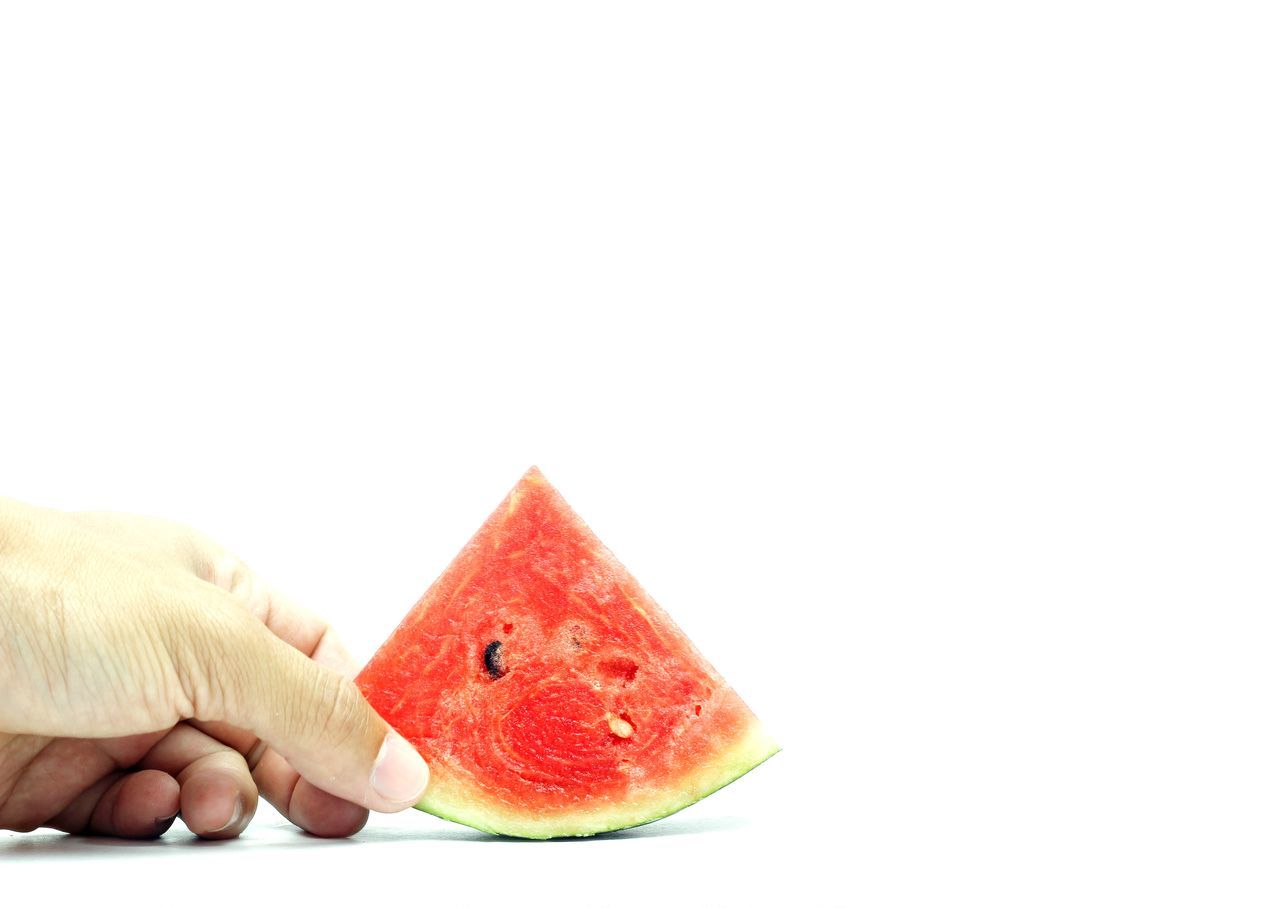 Hands are melting watermelon