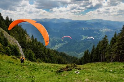 Paragliders over mountains