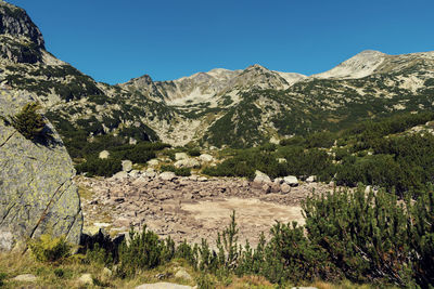 View of a dry alpine lake in pirin national park in bulgaria result of global climate change 