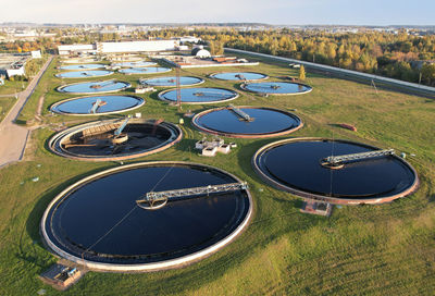 High angle view of lake amidst field in city