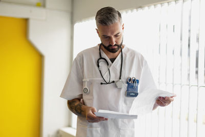 Doctor reading medical records