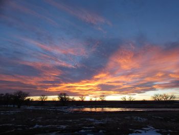 Scenic view of landscape at sunset