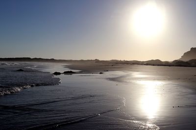 Scenic view of sea against clear sky during sunset