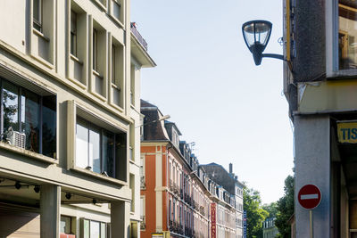 View of residential buildings against clear sky