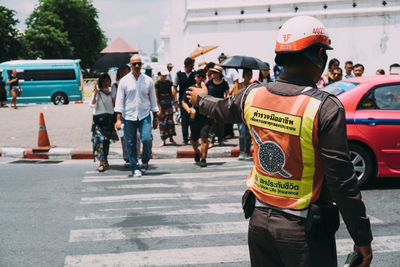 People on road in city