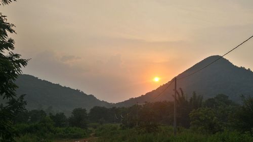 Scenic view of mountains against sky during sunset