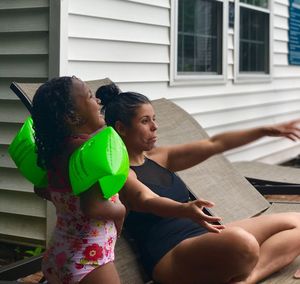 Mother and daughter in yard