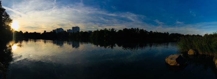 Scenic view of lake against sky during sunset