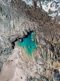 High angle view of rock formations in water