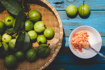 High angle view of fruits in basket on table