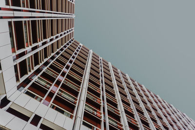 Low angle view of office building against sky