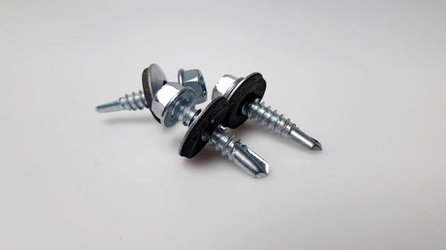 High angle view of metal container against white background