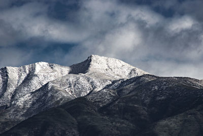 Close-up of snowcapped mountain against sky