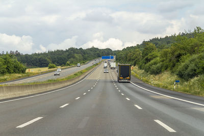 Cars on road against sky