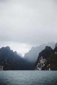 Scenic view of mountains and sea against sky