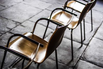 High angle view of empty chair on table
