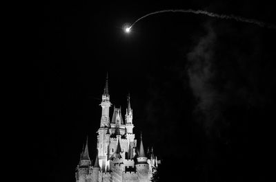 Low angle view of illuminated cathedral against sky at night