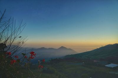 Scenic view of mountains against sky during sunset