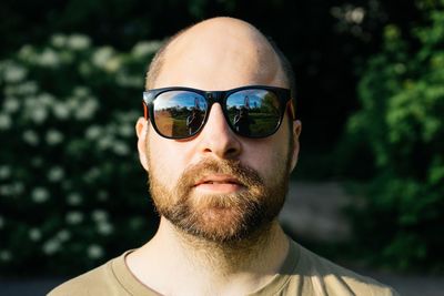 Close-up portrait of mid adult man wearing sunglasses