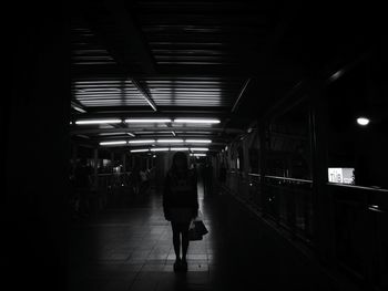 People at railroad station at night