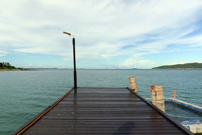 Pier over sea against sky