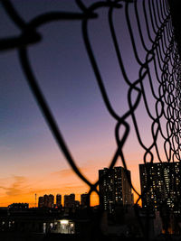 Silhouette of city buildings during sunset