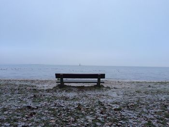 Scenic view of beach against clear sky