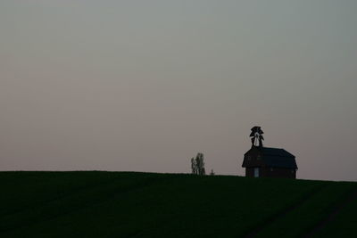 Built structure on field against clear sky