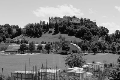 Built structure on landscape against sky