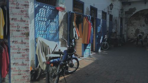 Bicycles on street amidst buildings in city