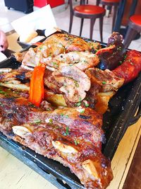 Close-up of meat on barbecue grill